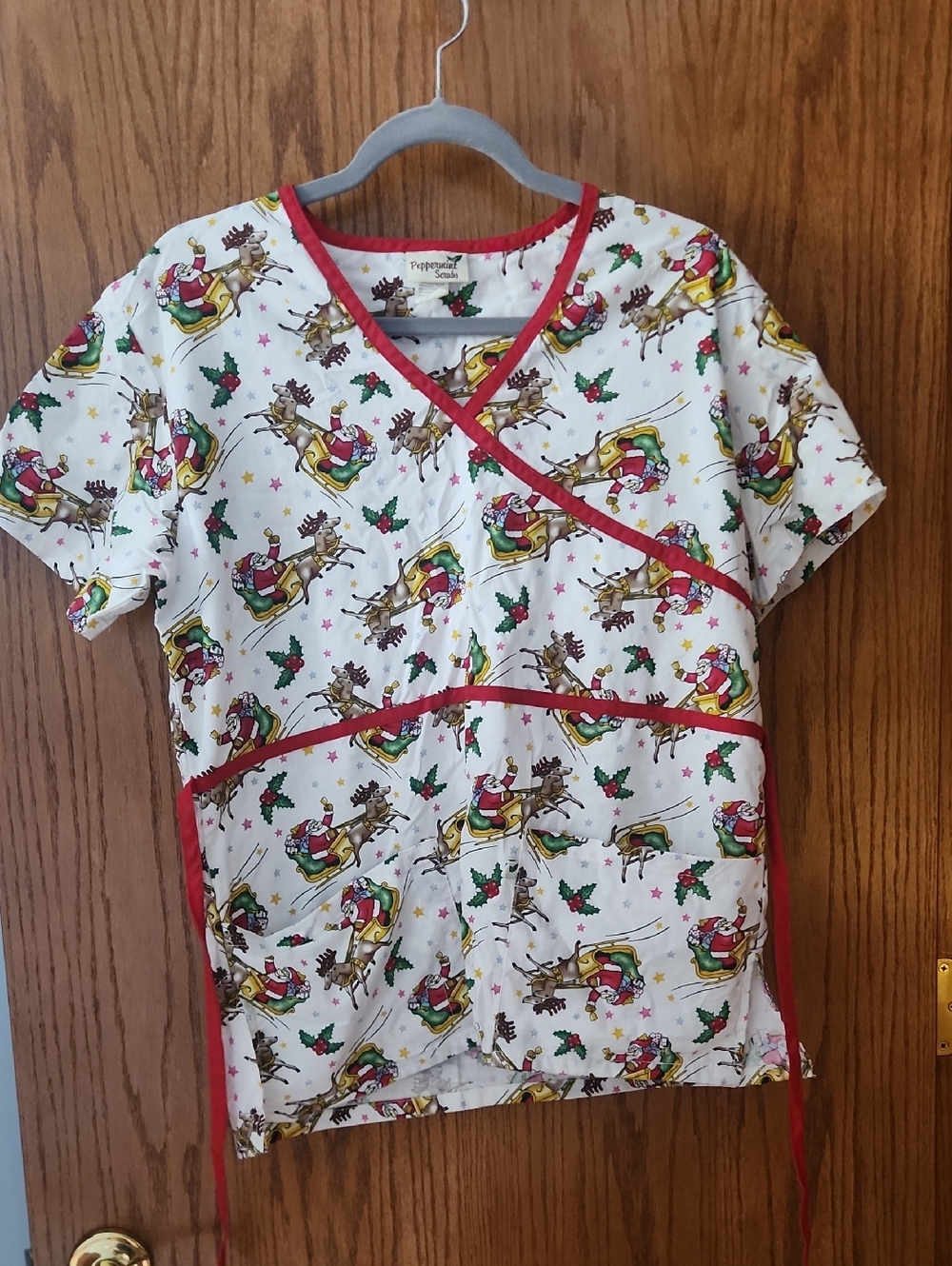 Peppermint White Short Sleeve Scrub Top with Red Trim and Holiday Reindeer Print